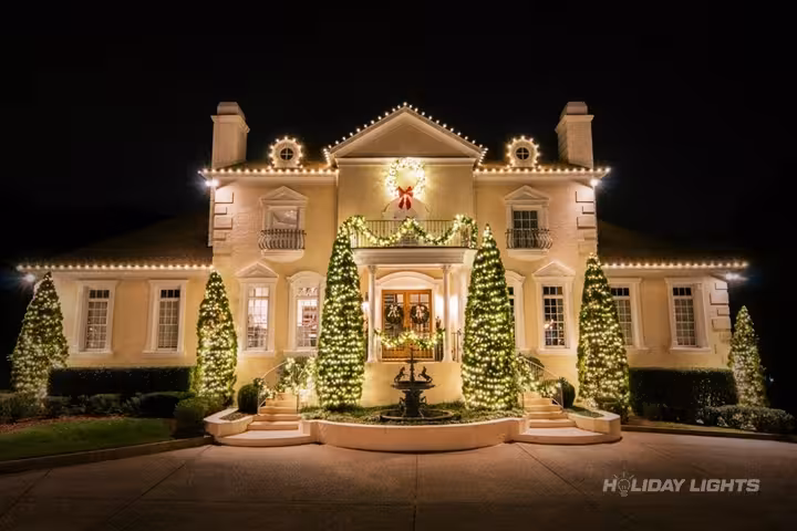Professional residential Christmas light installation in Carthage, New York — Roofline Lights with Evergreen